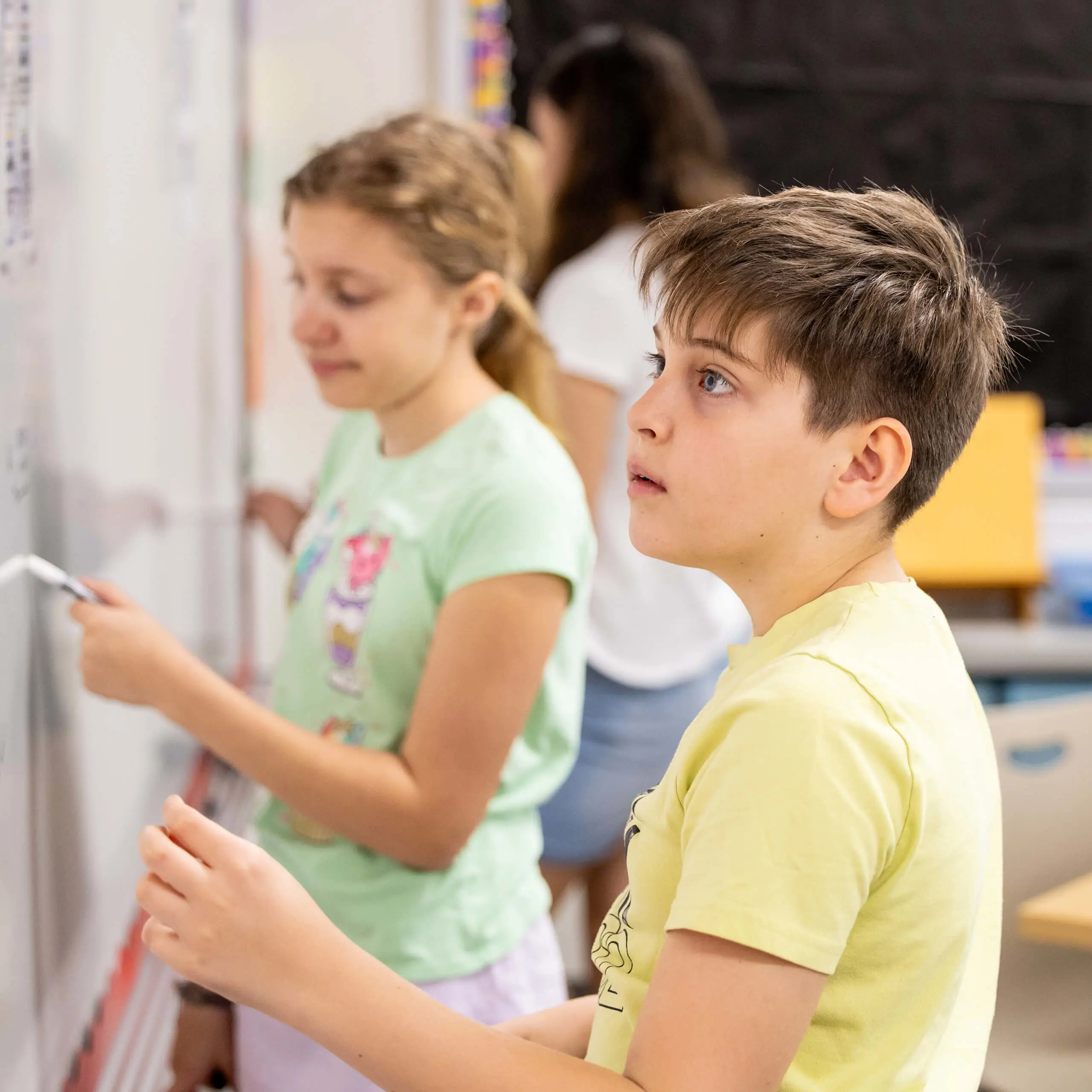 students working at a whiteboard