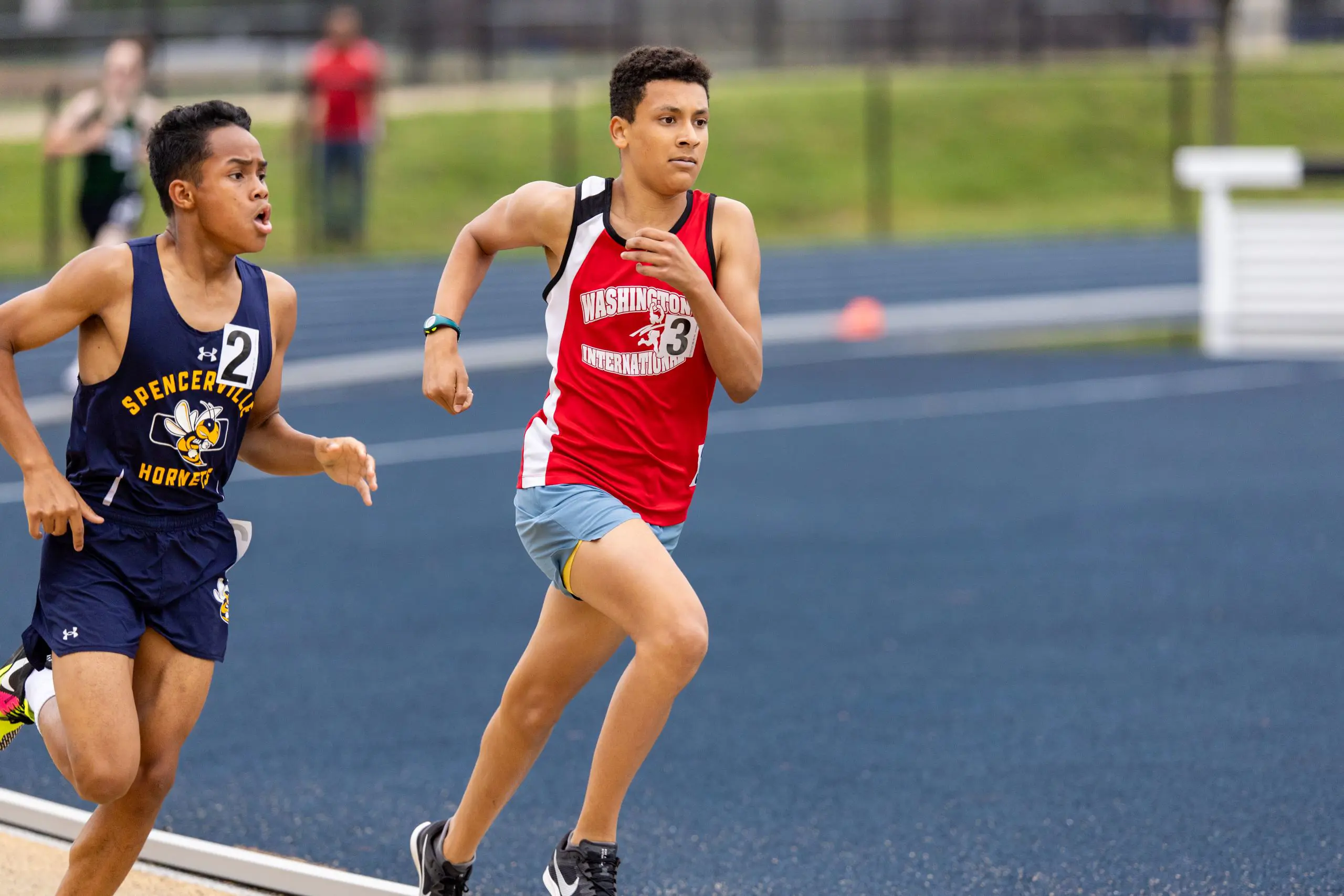 Athletes sprinting on track