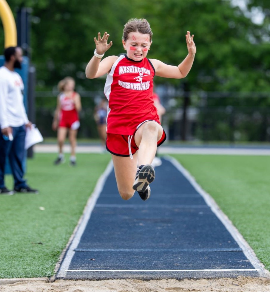 Girl competing in a long jump