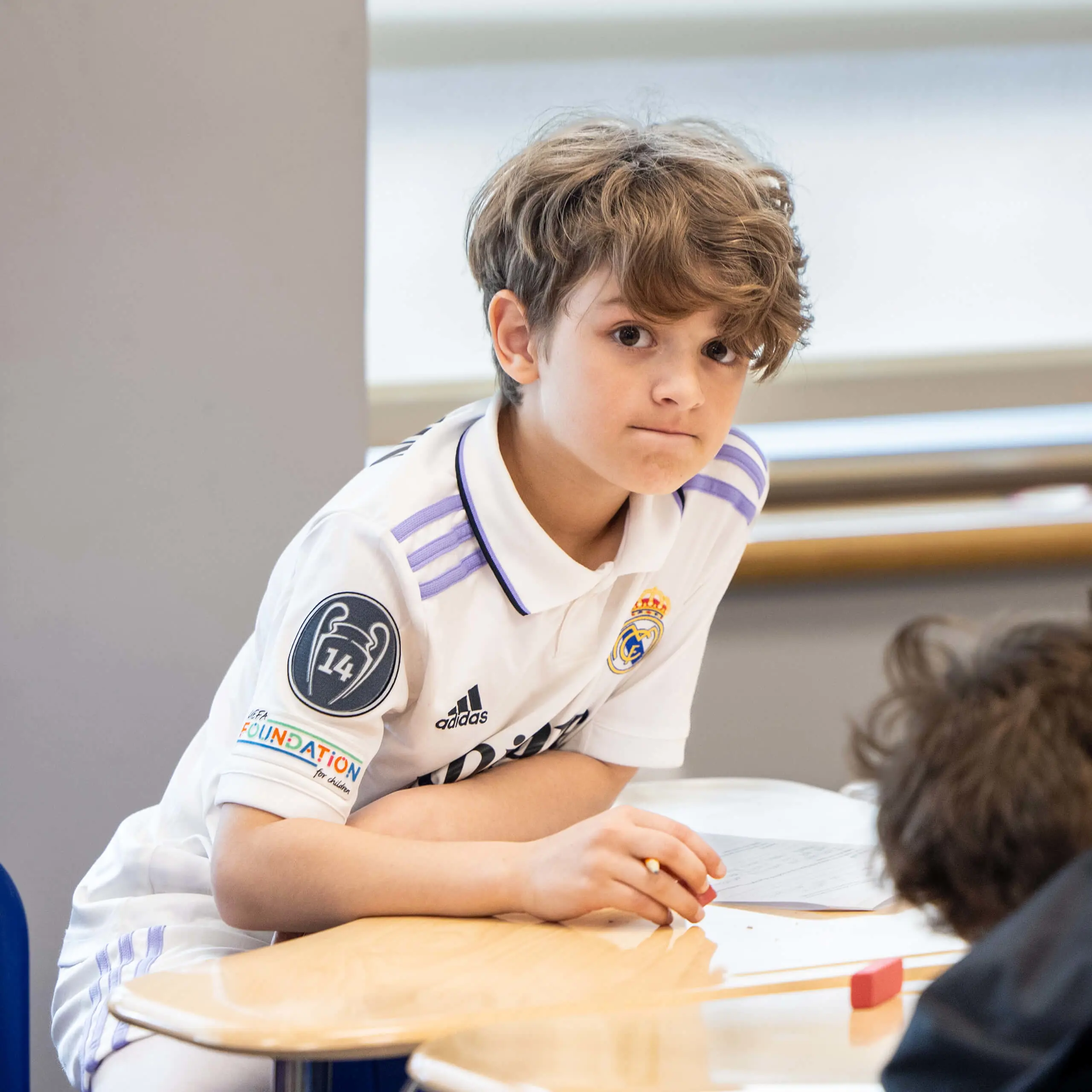 boy wearing a soccer jersey