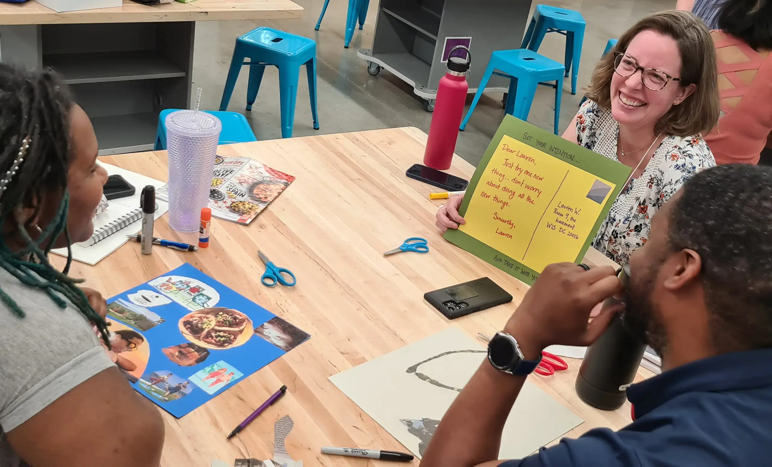 Three teachers working on a project