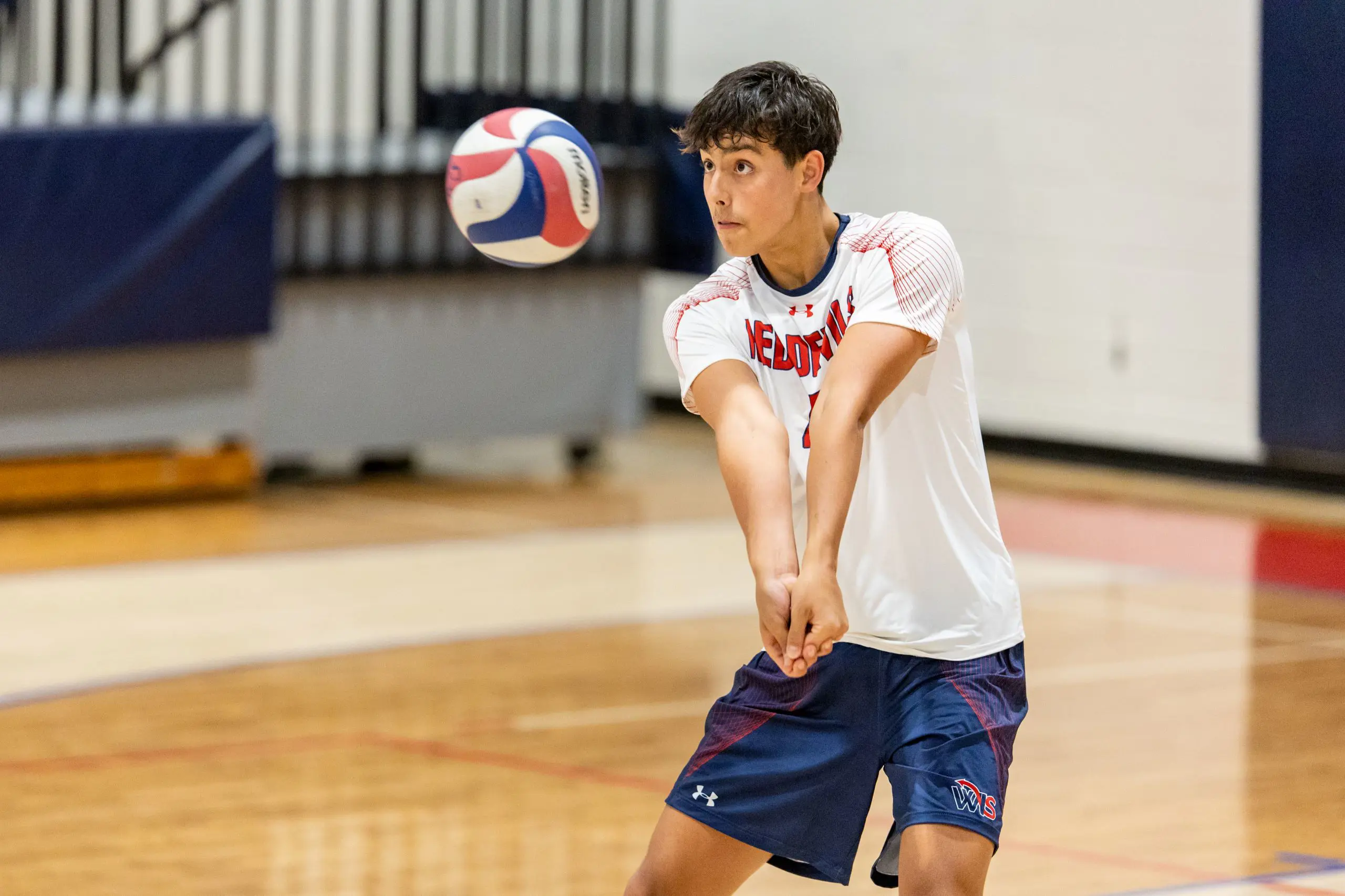 Student playing volleyball