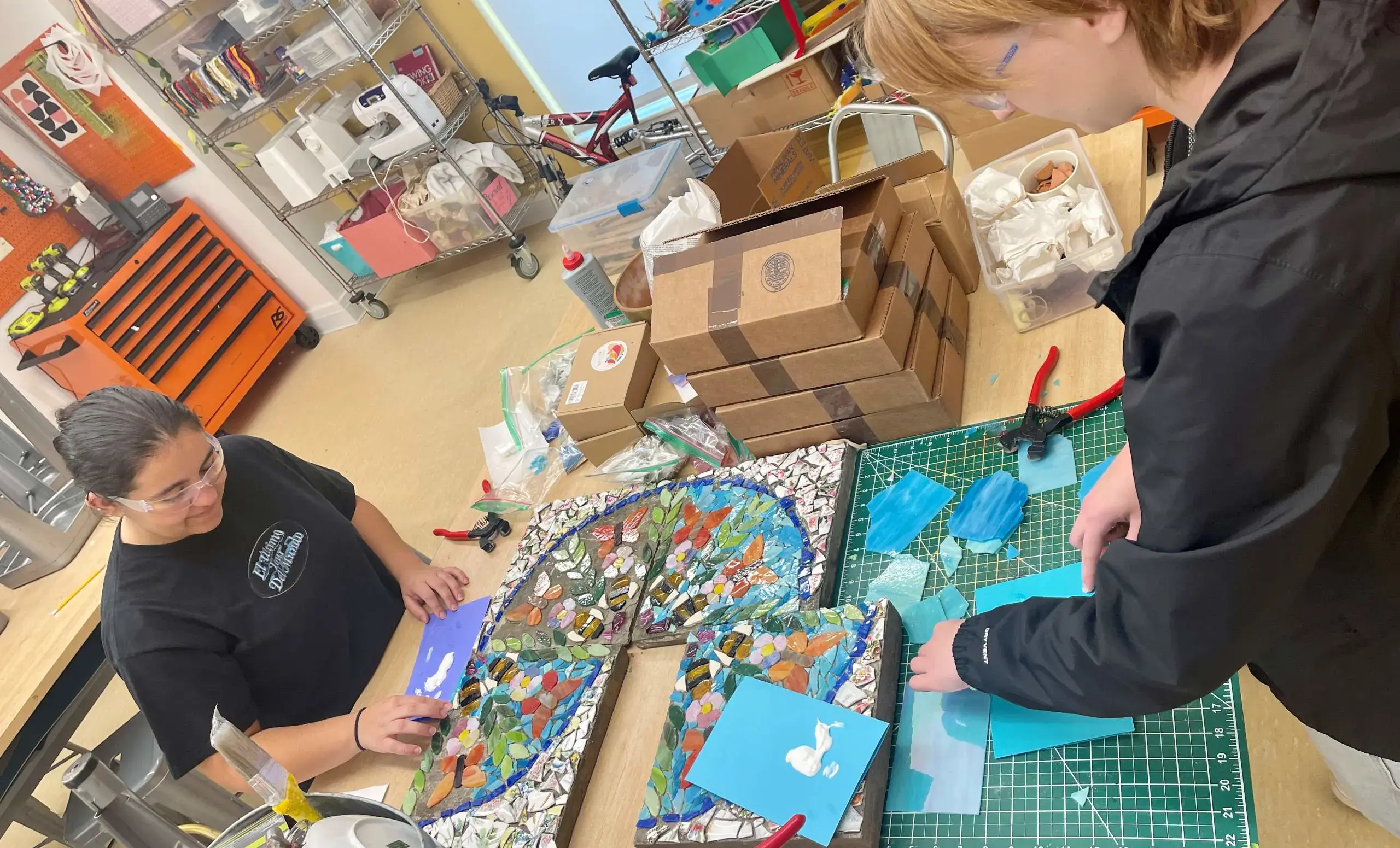 Two girls working with mosaics