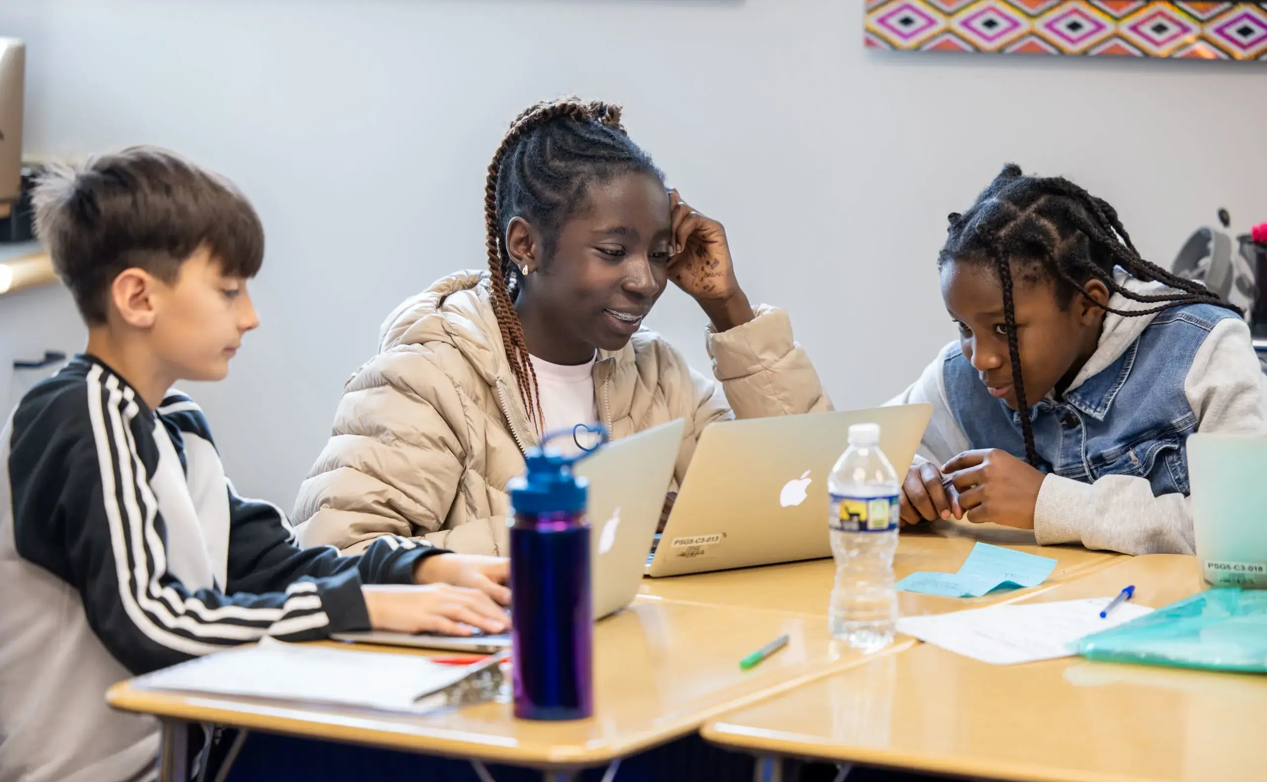 Three students on computers